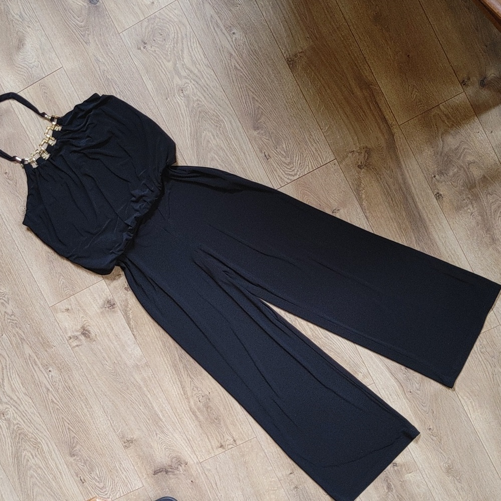 Black formal wide leg jumpsuit with gold halter neckline